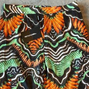 Prettylittlething sheer black tribal beach print flares